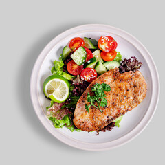 Grilled chicken with vegetables top view isolated