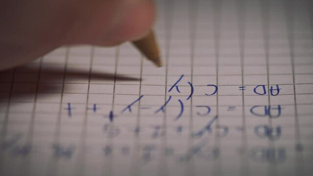 Detail of hand writing mathematical formulas