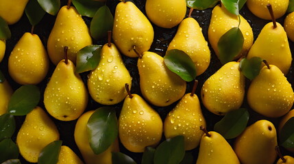 Pattern of yellow pears with water droplets on them, dark background