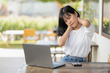 Asian women experience neck pain while working with a laptop, being stressed, or using a computer for a long time.