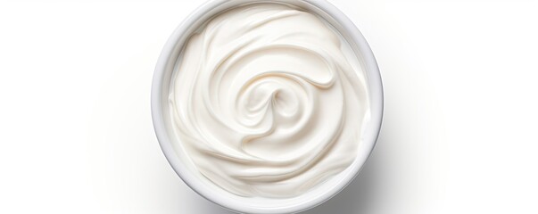 Fototapeta na wymiar Top view of isolated bowl of sour cream or Greek yogurt on white background