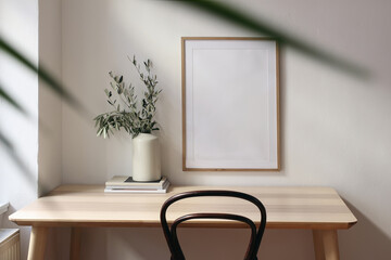 Empty vertical picture frame mockup. Wooden desk, table. Vase with olive branches, magazines....