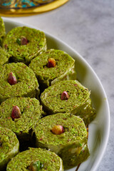 A close-up photo of Arabic and Turkish sweets and baklava with pistachios, Ramadan sweets