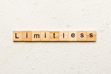 Limitless word written on wood block. Limitless text on cement table for your desing, concept