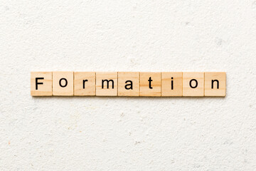 formation word written on wood block. formation text on table, concept