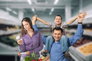 Happy family shopping in big supermarket