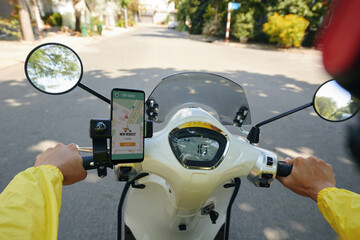 Pov of motorbike taxi driver checking new requests via mobile application