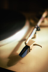 Close-up of a turntable tonearm. Concept of stereo music, analog sound, audiophiles, album music,...