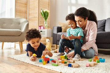 jolly beautiful african american woman playing with toys with her adorable little sons at home