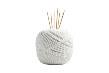 White Ball of Yarn With Needles. A white ball of yarn sits on a surface, with knitting needles inserted into it. The needles are positioned vertically in the center of the yarn ball. - obrazy, fototapety, plakaty
