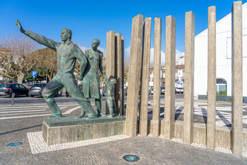 Monument in honor of the Azorean emigrant on an avenue in Ponta Delgada-Sao...