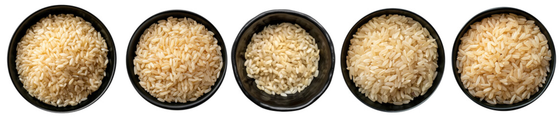 Top view bowls with raw carnaroli rice isolated on a black surface - obrazy, fototapety, plakaty