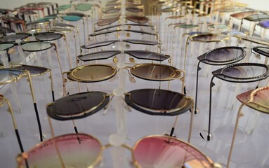 Fototapeta na wymiar A showcase with colorful sunglasses from the sun