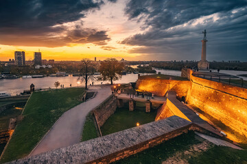 enchanting beauty of Belgrade's Kalemegdan at twilight, where historic landmarks are illuminated...