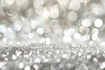 Abstract silver background with shimmering bokeh light effects for a sophisticated and glamorous feel