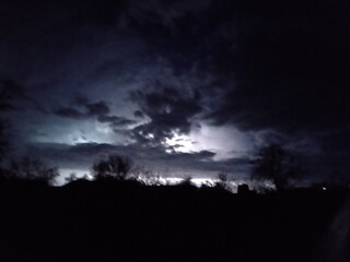 Naklejka premium clouds over the forest