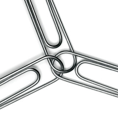 Three Paperclips Clipped Together Representing Teamwork