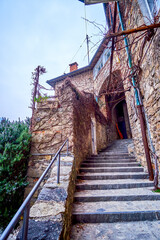 Narrow street with steep staircases in old Gandria village, Switzerland