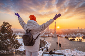 Winter Serenity: Amidst the snow-covered landscape of Kalemegdan, a woman stands in awe of the...