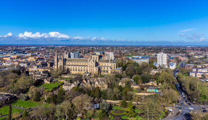 An aerial view towards the cathedral and grounds in Peterborough, UK on a bright sunny day