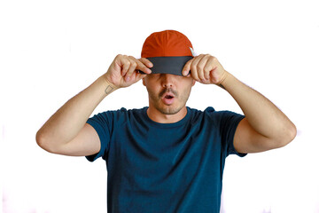 expressive bald man making hand gesture and funny face , hiding under his cap