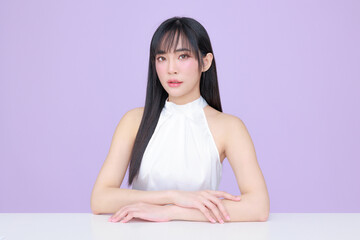 Obraz na płótnie Canvas Young Asian beauty woman model long hair with natural makeup look on face and perfect clean skin on isolated violet background. Facial treatment, Cosmetology, Spa, Aesthetic, plastic surgery.