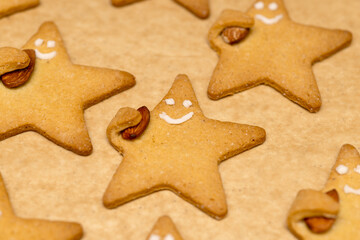 Fototapeta na wymiar star cookies with nuts and decoration after baking Close-up