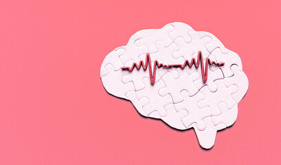 Human Brain Puzzle with Heart Rate Signal on Red