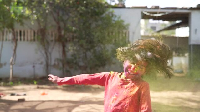 Kids playing with color at home During holi Festival of Colors