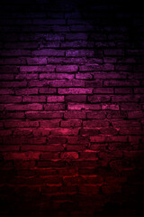 Vertical Neon light on brick walls that are not plastered background and texture. Lighting effect red and blue neon background of empty brick basement wall.