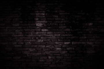 Black brick walls that are not plastered background and texture. The texture of the brick is black. Background of empty brick basement wall.