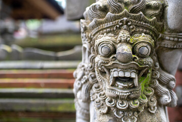 stone sculpture of balinese god