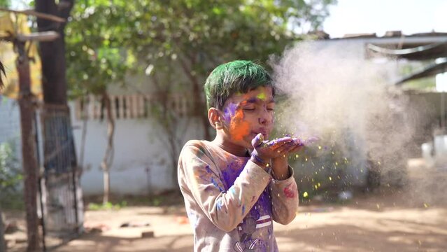 Celebration of Holi festival day colorful footage of Group of Cheerful kids playing holi