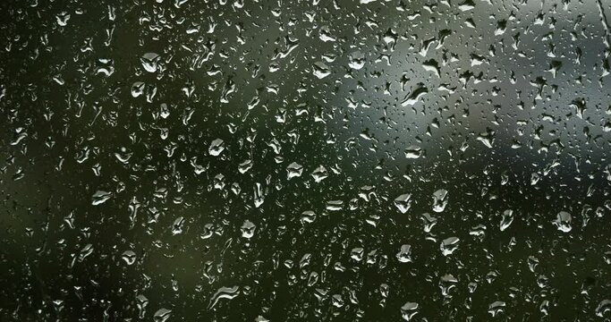 Rain dropping on glass windows