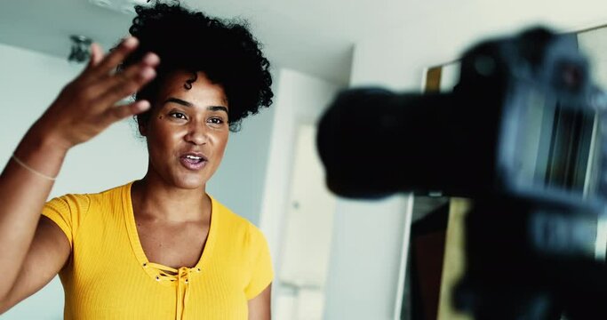 One Dynamic 20s Black Woman Recording Testimonial Video, Engaging Online Audience as a New Media Vlogger