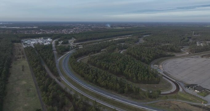 Aerial drone view on test track for the mobility industry. Test driving area circuit. Turns corners straights on asphalt.