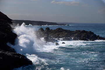 Fototapeta premium Sea and rocks. Cliffs in El Golfo, a coastal village on the island of Lanzarote (Spain).