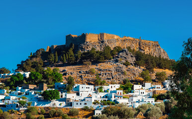 The majestic Lindos Acropolis and old town. - obrazy, fototapety, plakaty