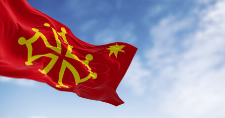 The flag of Occitanie region waving in the wind on a clear day