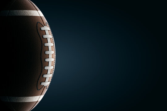 american football ball against dark background. American sports concept, grand final, strength, victory. Advertising poster, design, copy space, 3D render, - Powered by Adobe