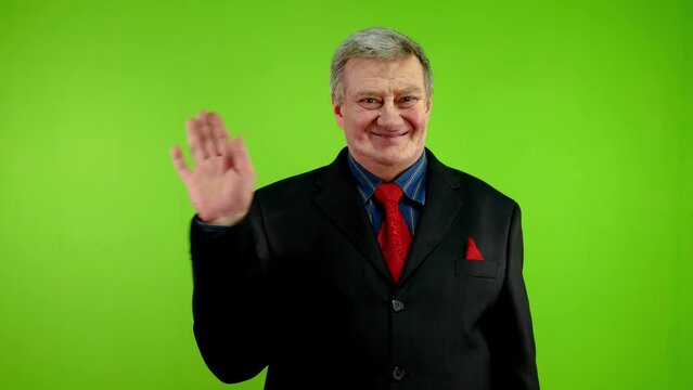 Businessman waves palm greeting or goodbye sign.