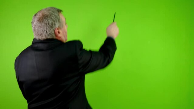 Businessman presents and tells on green screen.