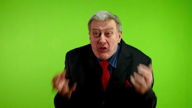 Angry businessman waves his hands, swears loudly.