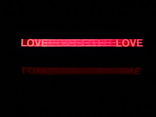 Love word in pink made moving a stencil and the reflection of the words