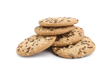 Round cereal crackers with flax, sunflower and sesame seeds isolated on white