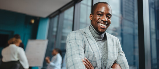Young african entrepreneur smiling confidently in a professional office boardroom meeting