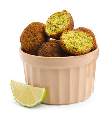 Delicious falafel balls in bowl and lime slice isolated on white