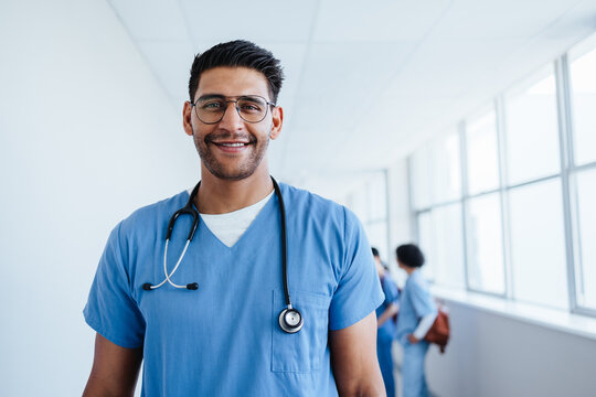 Male hospital intern looking at the camera with confidence