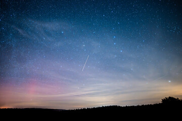 Beautiful night sky with aurora borealis in the Czech Republic