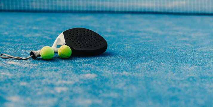 Lifestyle game on blue court: Padel tennis with rackets and ball